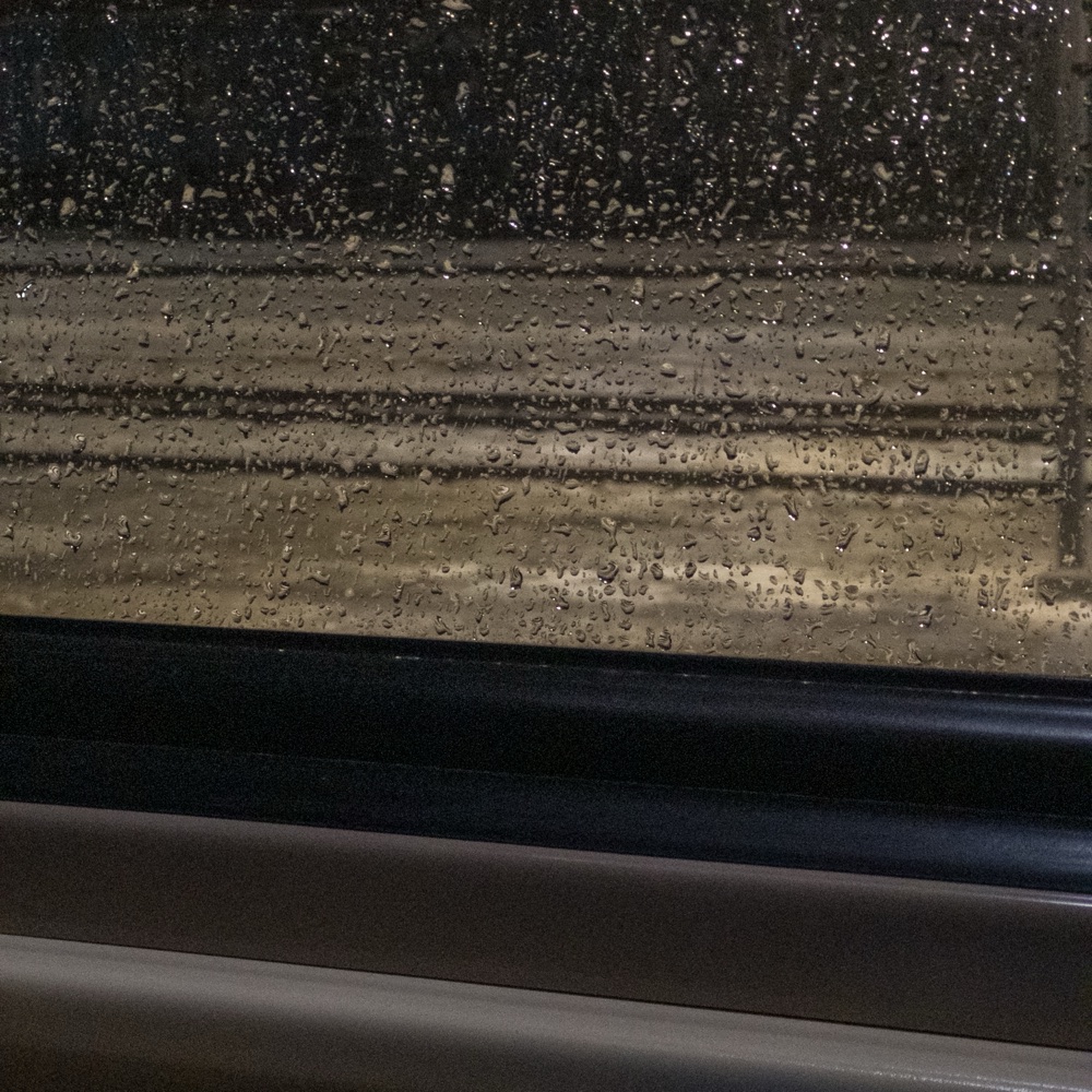 Vladimir's Theme cover art — rain on a train window at dusk